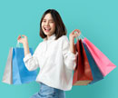 Young girl holding shopping bags